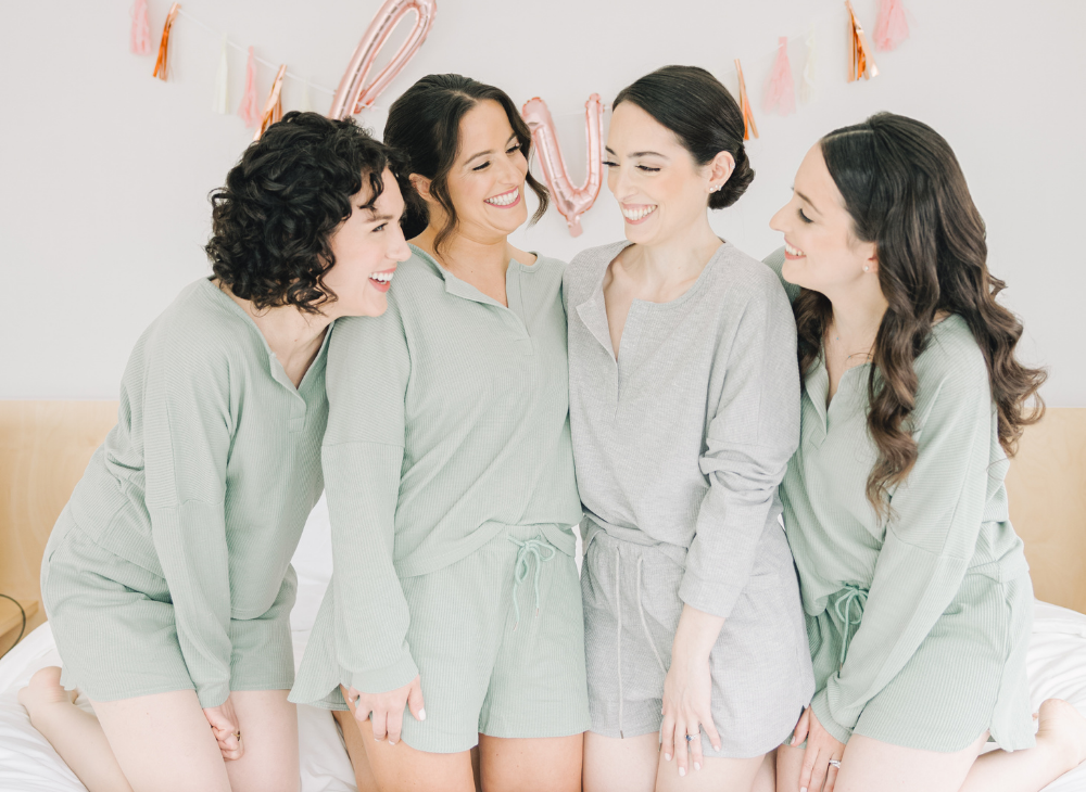 sage green bridesmaids in pajamas at the Asbury Hotel 