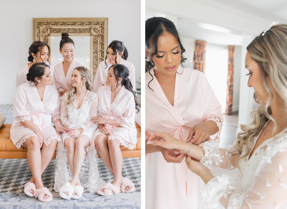bridesmaids in pink robes sitting on couch and putting on jewelry