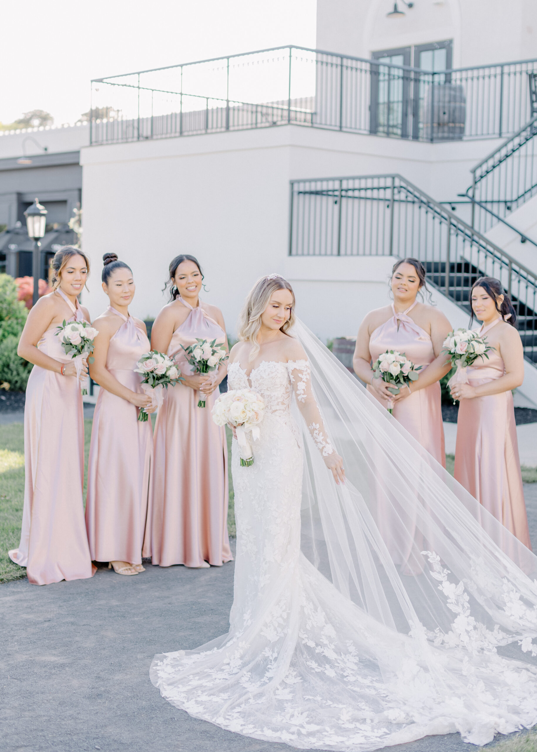 bridesmaids in pink outside renault winery