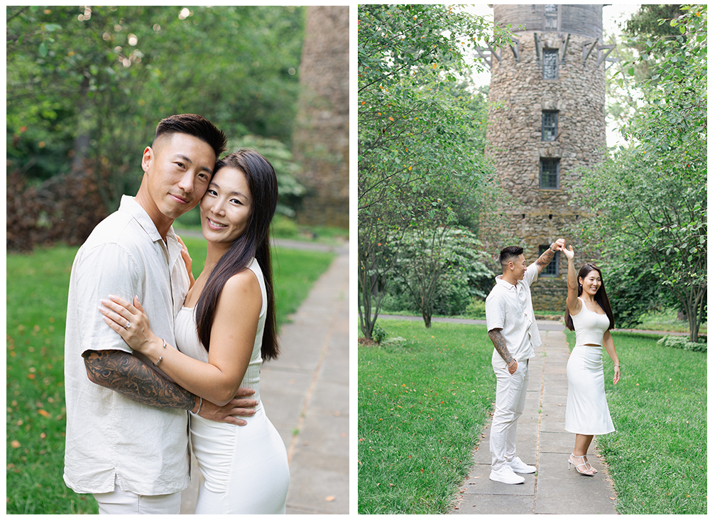 engaged couple dancing and hugging in front of stone tower at cross estate gardens