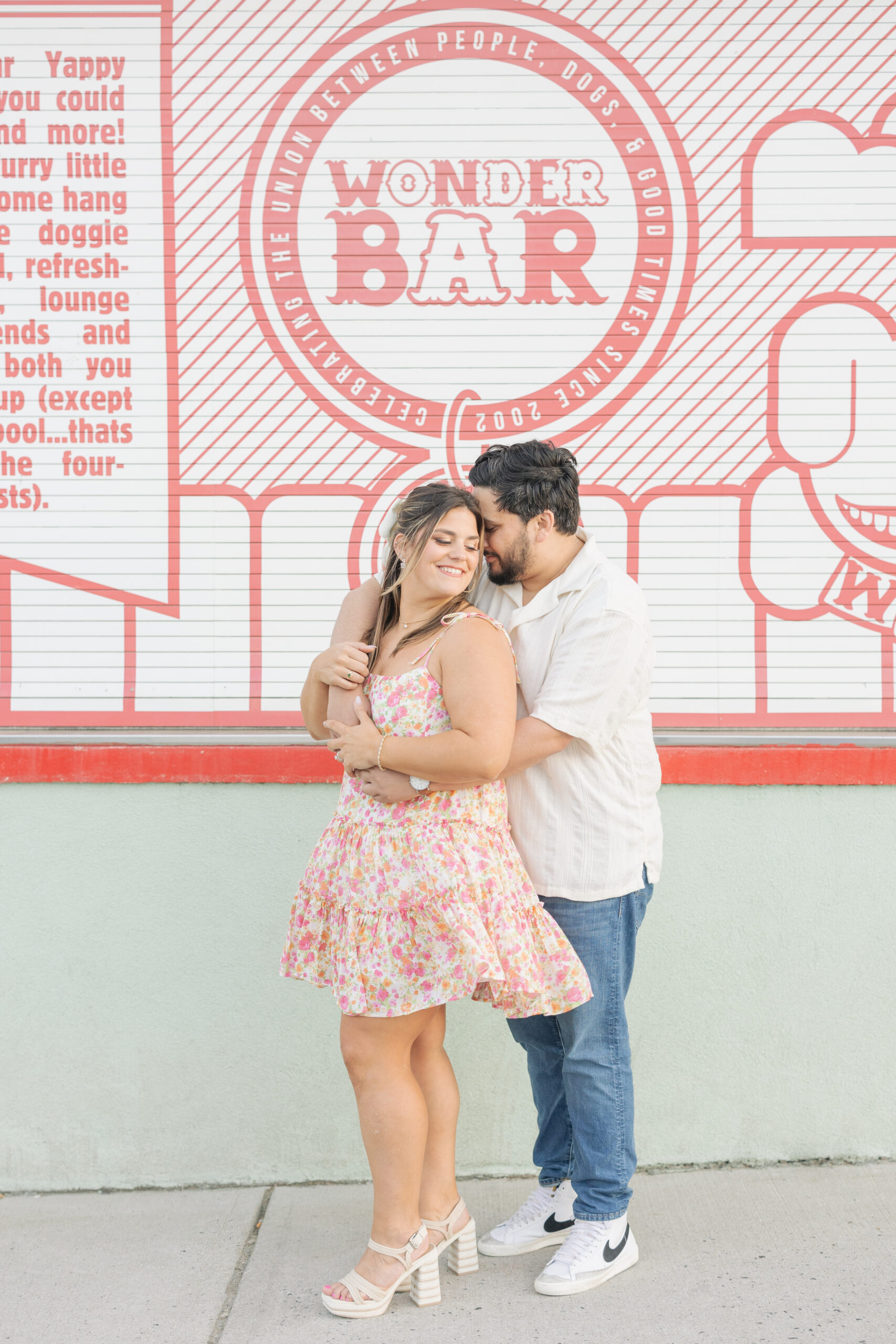 couple hugging at wonder bar asbury park
